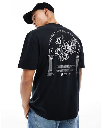 ASOS Camiseta negra holgada con estampado floral en la espalda - Negro