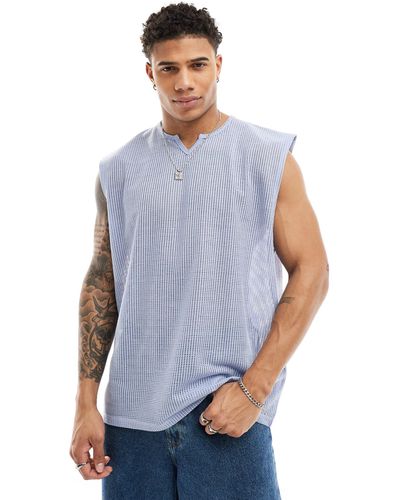 ASOS Camiseta extragrande sin mangas con muesca en el cuello - Azul