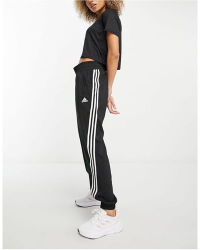 adidas Originals Adidas - training train icons - joggers neri con 3 strisce - Bianco