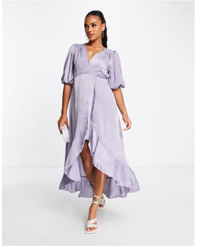 https://cdna.lystit.com/400/500/tr/photos/asos/8917cdcd/flounce-london-Blue-Satin-Puff-Sleeve-Maxi-Wrap-Dress.jpeg