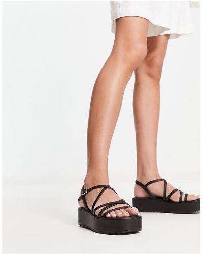 Schuh Sandalias negras con diseño - Blanco