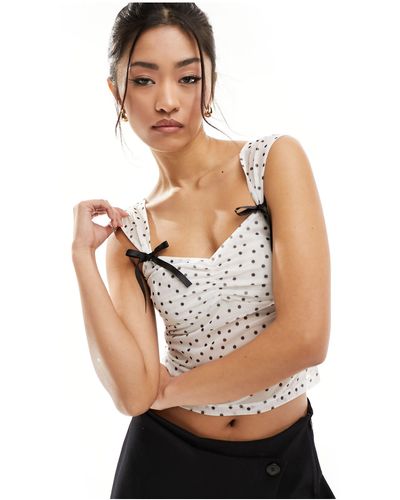 ASOS Top style folk à pois avec manches courtes et détail nœuds - Blanc