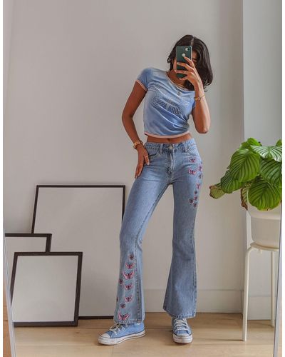 Labelrail X Pose And Repeat Mid Rise 90s Flared Jeans With Butterfly Appliques - Blue