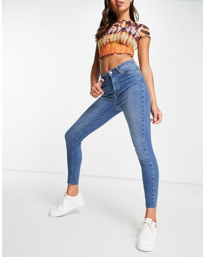 NA-KD Katoenen Skinny Jeans Met Hoge Taille En Onafgewerkte Zoom - Blauw