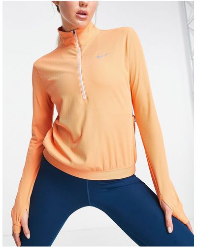 Nike Element seasonal novelty dri-fit - top color corallo con zip corta - Blu