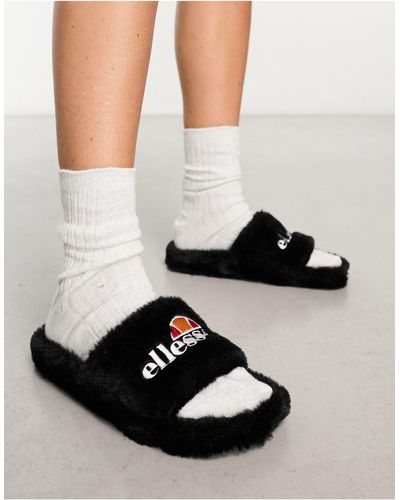 Ellesse Filippo - chaussons façon claquettes en fausse fourrure - Noir