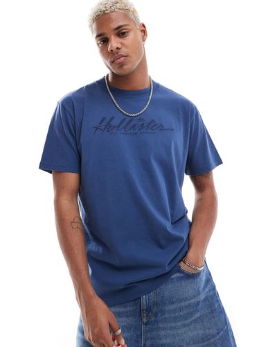 Hollister Camiseta azul oscuro holgada con estampado en la espalda