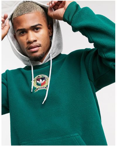 adidas Originals – kapuzenpullover mit college-wappenmotiv aus em fleece - Grün