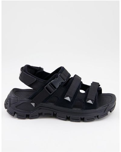 Men's Caterpillar Sandals, slides and flip flops from $50 | Lyst
