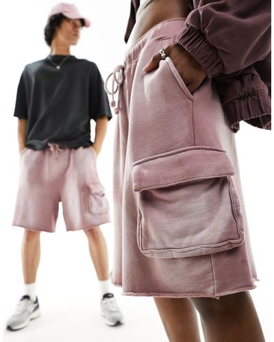ASOS Pantalones cortos rosa lavado cargo extragrandes unisex con bajos sin rematar