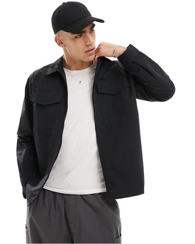 Champion Camicia giacca multitasche nera con zip - Nero