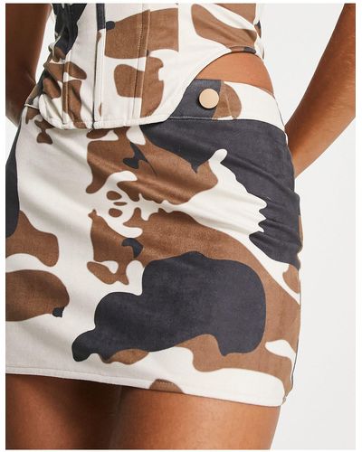 Public Desire Mini-jupe d'ensemble ultra-courte à taille basse - imprimé vache - Multicolore