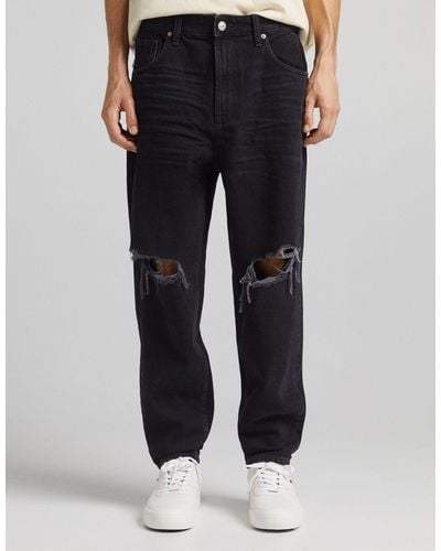 Bershka Tapered Jeans With Rips - Black