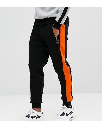 Hype Skinny Sweatpants In Black With Orange Stripe