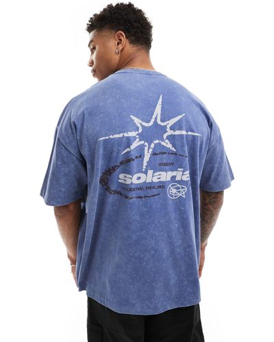 ASOS Camiseta azul lavado extragrande con estampado cósmico en la espalda