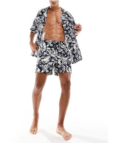 Tommy Hilfiger Essential - pantaloncini da bagno con stampa tropicale monocromatica e coulisse - Multicolore