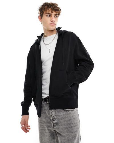 Calvin Klein Felpa con cappuccio e zip nere con stemma con logo - Nero