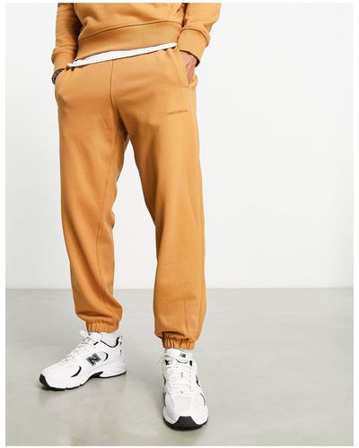 New Balance Athletics state - pantaloni della tuta color cuoio - Bianco