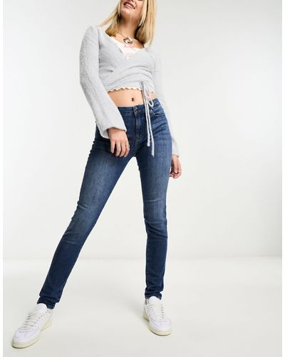 Love Moschino Jeans skinny lavaggio medio con stampa del logo a forma di cuore - Blu