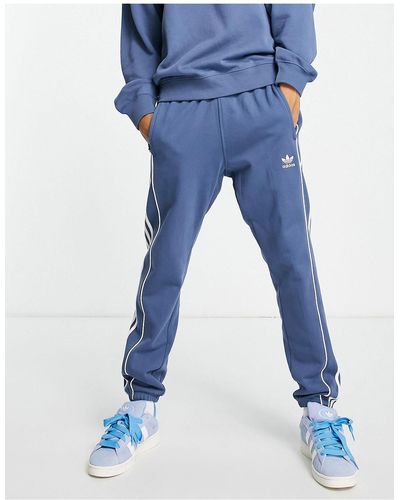 adidas Originals Rekive - joggingbroek Met 3-stripes - Blauw