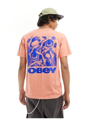 Obey T-shirt color pesca con stampa grafica di occhio sul retro - Bianco