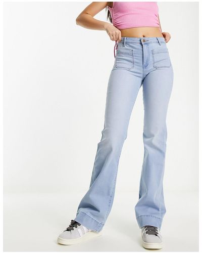 Wrangler Jeans a zampa lavaggio west coast a vita alta con tasche sul davanti - Blu