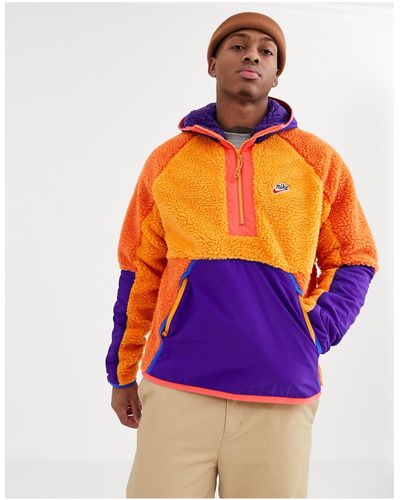 Nike – Fleece-Winterjacke zum Überziehen mit kurzem Reißverschluss - Orange
