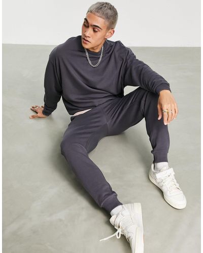 ASOS Tracksuit With Oversized Sweatshirt And Tapered joggers - Black