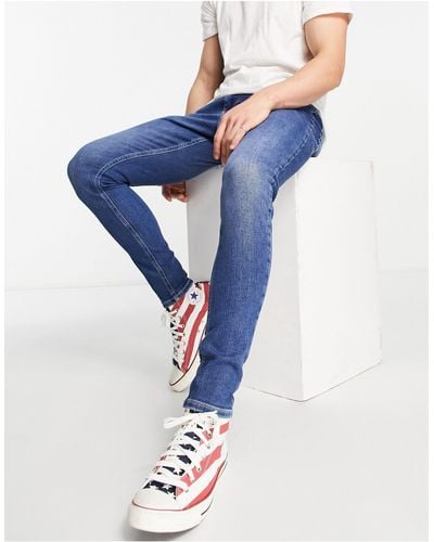 54% | for off Lyst up Skinny Tommy Online to jeans | Sale Men Hilfiger