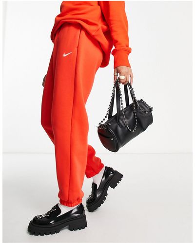 Nike Joggers oversize rossi con logo piccolo - Rosso