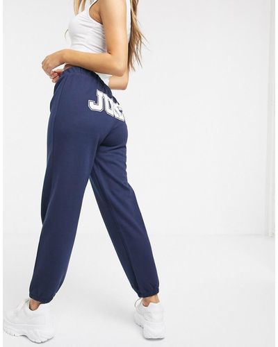 Juicy Couture – Hit Regal – Hose mit JXJC Juicy-Logo hinten - Blau