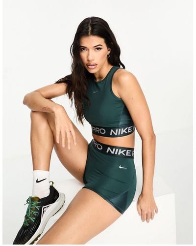 Nike – pro dri-fit – glänzendes, kurzes tanktop - Grün