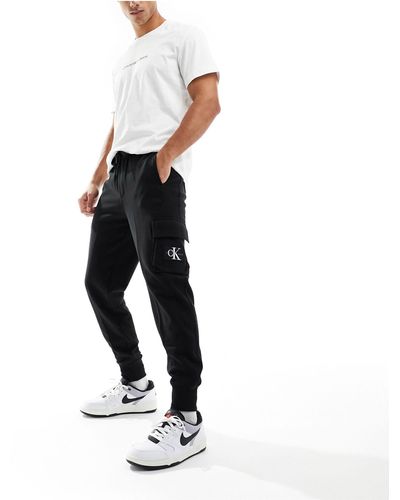 Calvin Klein Pantalones negros con parche - Blanco