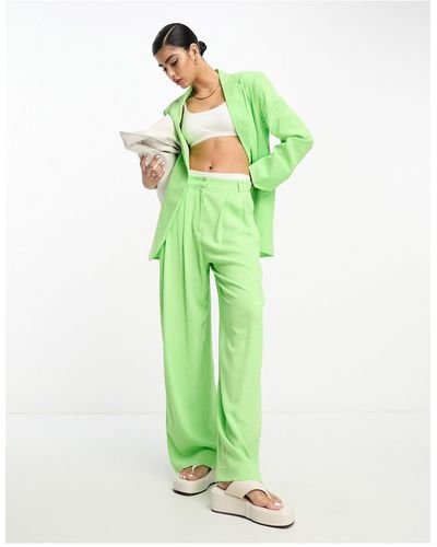 ASOS Pantaloni da abito a fondo ampio verdi con pieghe invertite - Verde