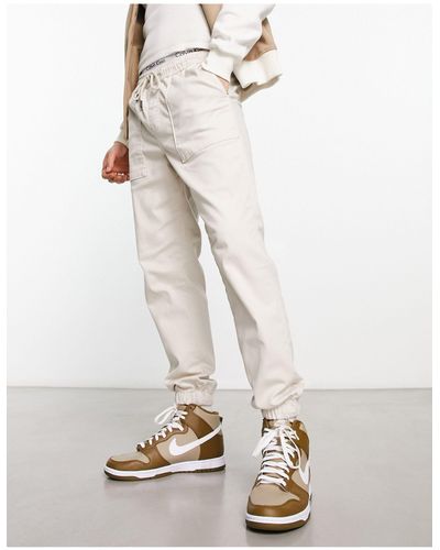 Jack & Jones Pantalones chinos color crema estilo worker con bajos ajustados - Blanco
