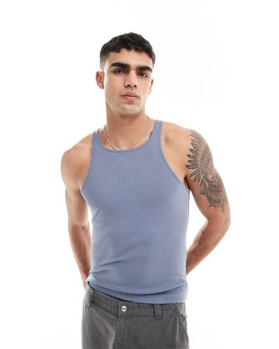 ASOS Camiseta azul ajustada sin mangas con cuello subido