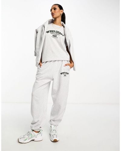 ASOS Oversized jogger Co-ord With West Coast Graphic - White