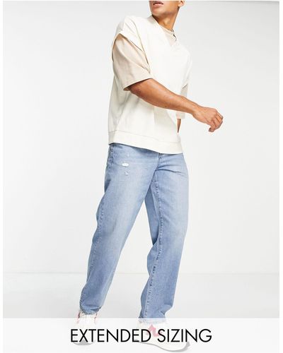 ASOS Ruimvallende Jeans Met Slijtageplekken - Blauw