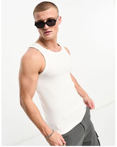 T-shirts sans manches et débardeurs Calvin Klein pour homme | Réductions en  ligne jusqu'à 53 % | Lyst