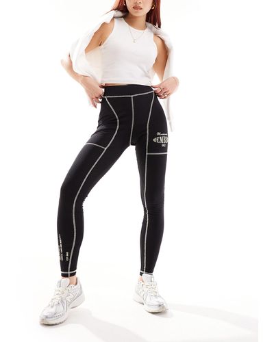The Couture Club Oversized Graphic leggings With Contrast Stitch - Black