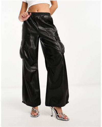 Miss Selfridge contrast stitch cargo faux leather jumpsuit in black