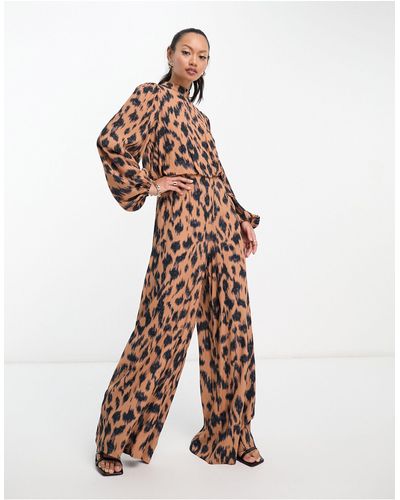 Never Fully Dressed Tuta jumpsuit a fondo ampio leopardata - Bianco