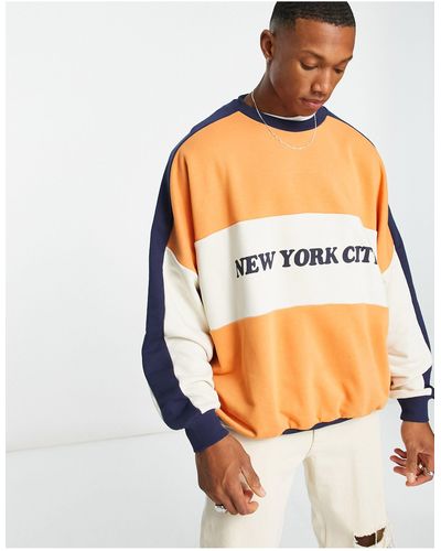 ASOS Sudadera beis extragrande con diseño color block - Naranja