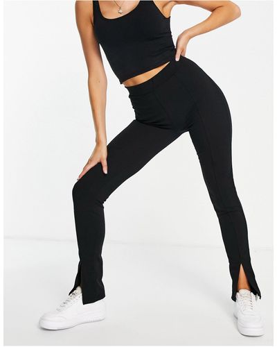 Rebellious Fashion Slit Front Flared Trousers - Black