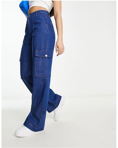 River Island Jeans con fondo ampio a vita alta medio con tasche cargo - Blu