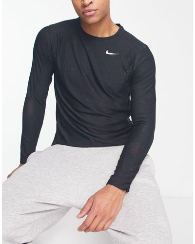 Nike D.y.e. - maglietta nera a maniche lunghe con stampa ripetuta - Blu