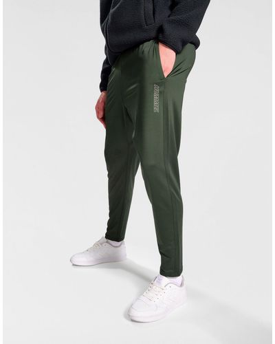 Hummel – schmal zulaufende jogginghose aus elastischem sweatshirt-stoff - Grün