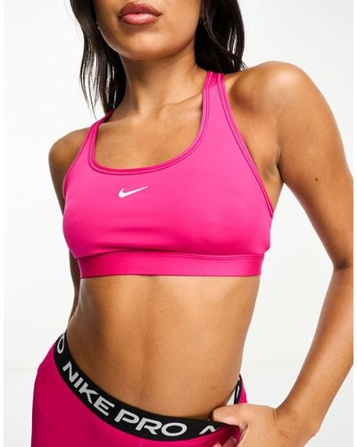 Nike Swoosh dri-fit - reggiseno sportivo a supporto leggero fireberry - Rosa