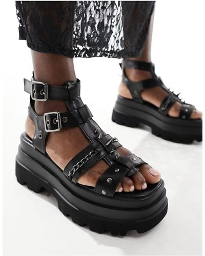 Koi Footwear Koi - he divine - sandali neri con borchie e suola spessa - Nero