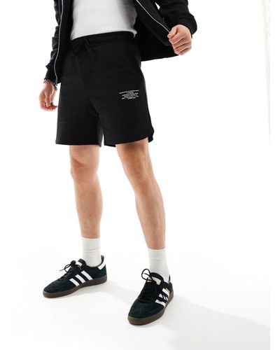 Jack & Jones – bedruckte jersey-shorts - Schwarz